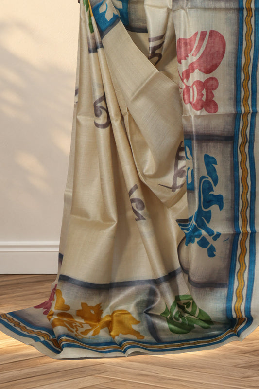 Ivory Batik Tussar saree with grey Bengali letters across the body