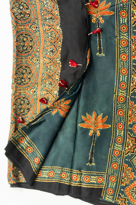 Dark bottle green Ajrakh saree with orange palm tree motifs