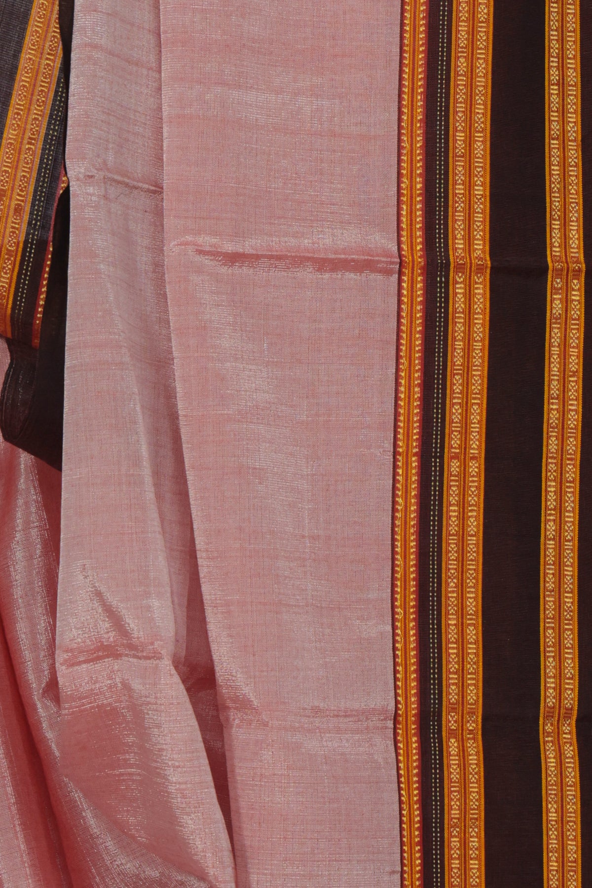 Close up of wine Gayatri border on light pink Ilkal cotton