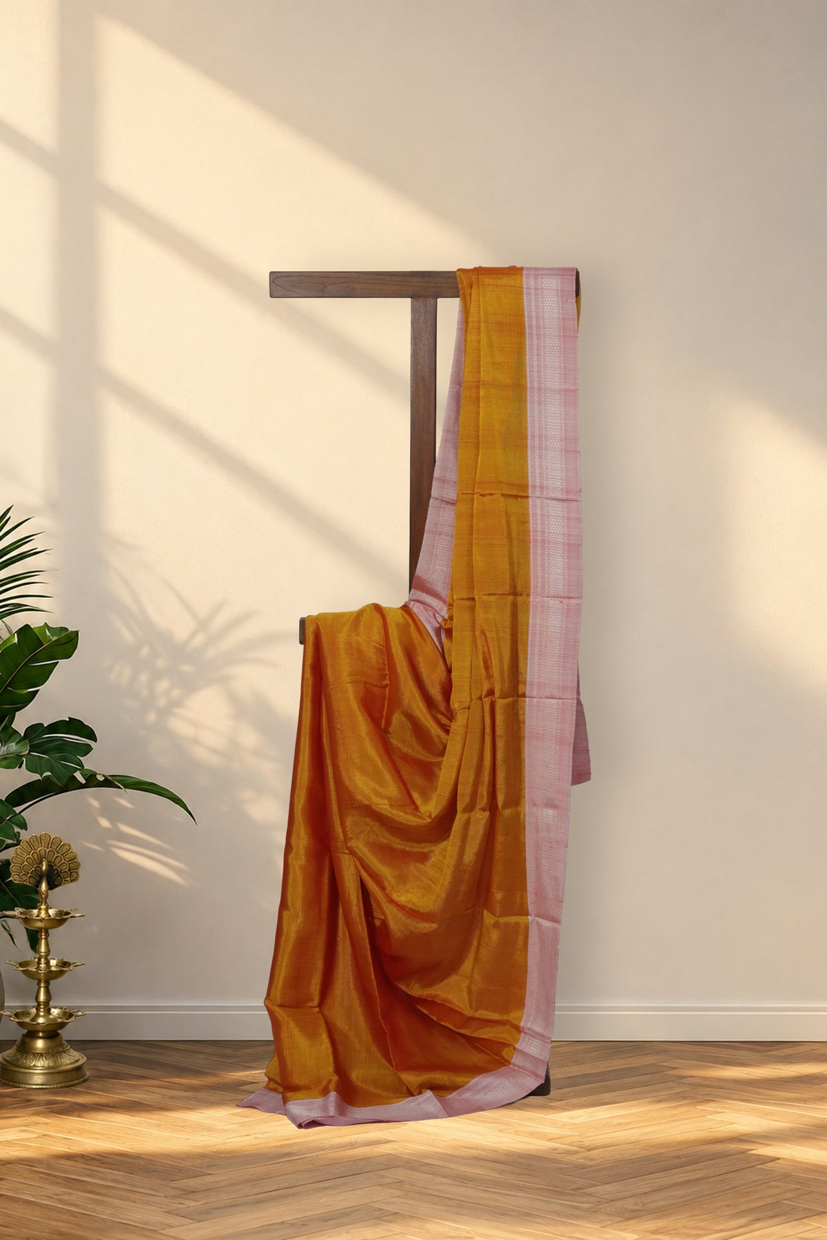 Sampige Hoovu turmeric yellow Ilkal saree with pink Chikki Paras border