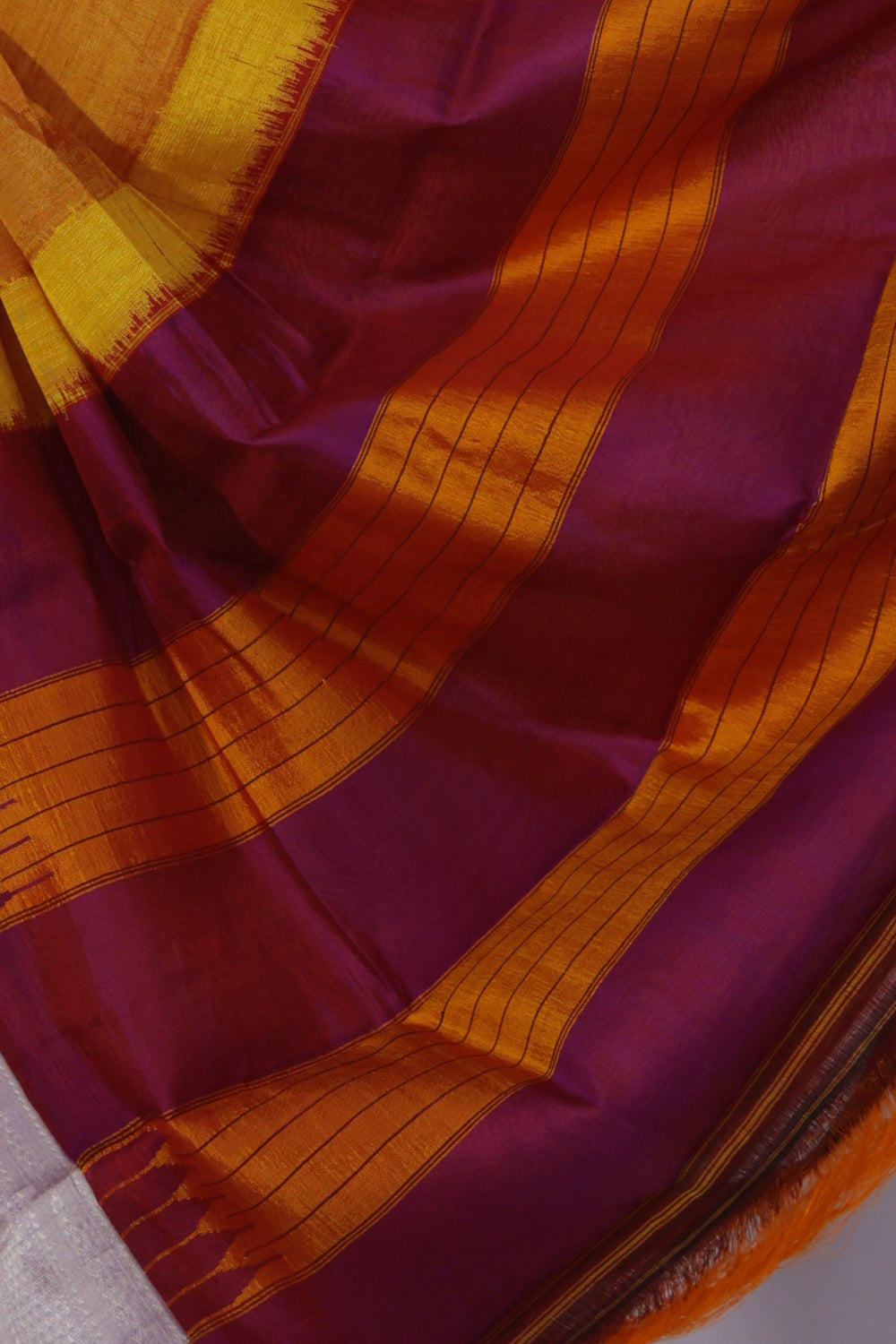 Fuchsia pink and yellow Gomi Teni pallu on turmeric yellow Ilkal saree
