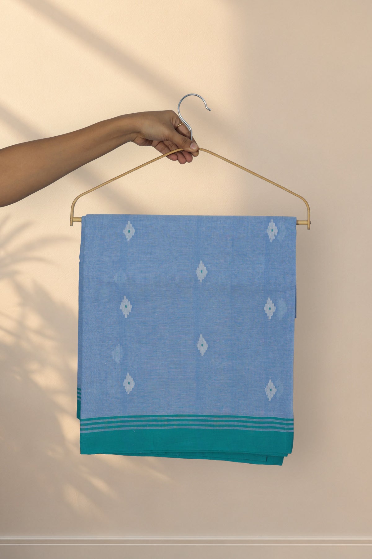 Meghla Din greyish blue Jamdani cotton saree with green border