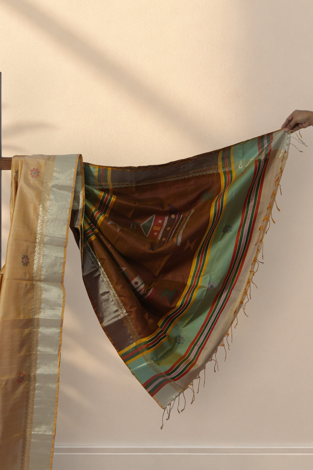 Zari border on Matir Bari pista green silk saree