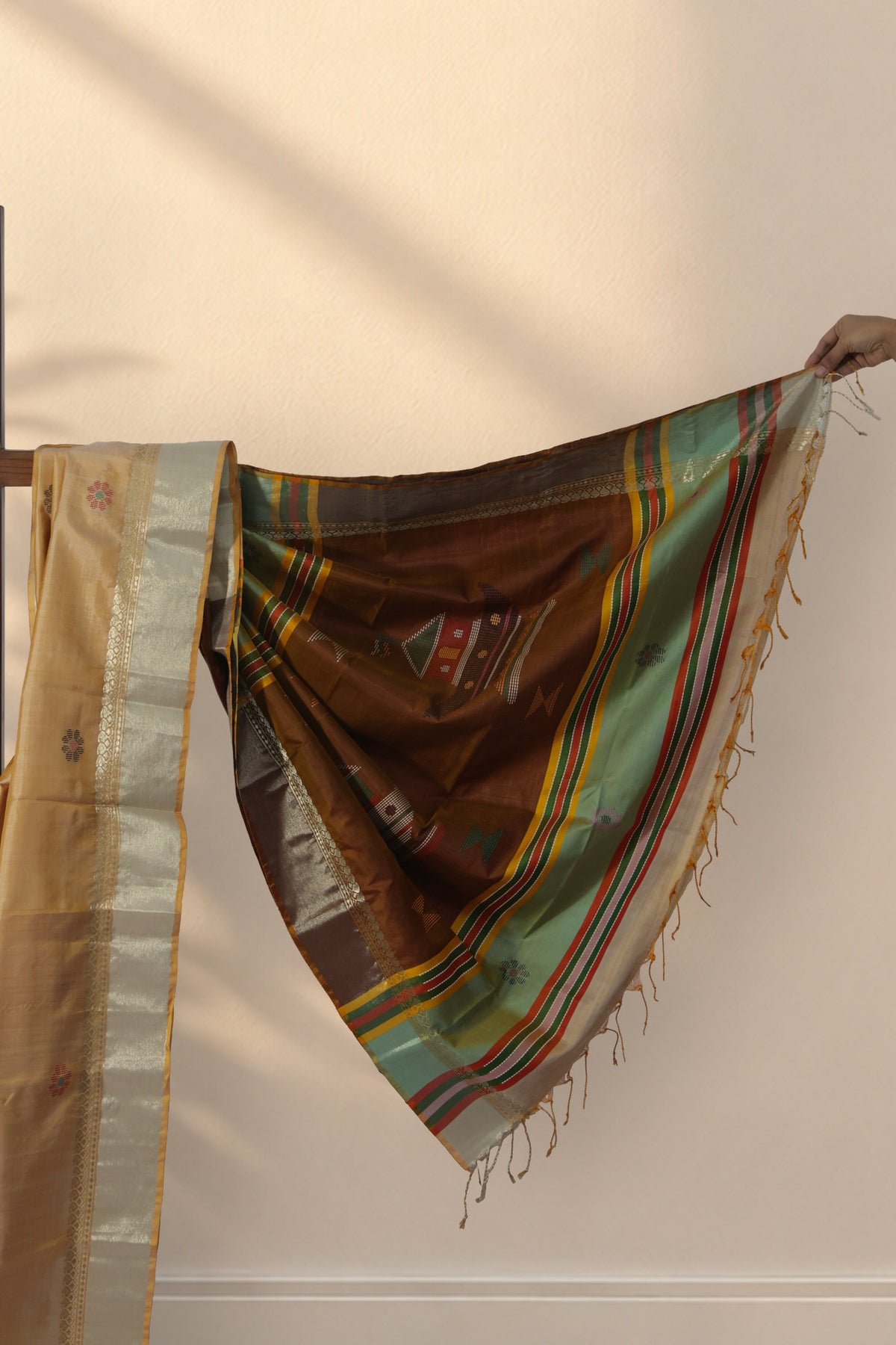 Zari border on Matir Bari pista green silk saree