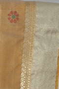 Close up of handwoven buttis on pista green Kalakshetra silk