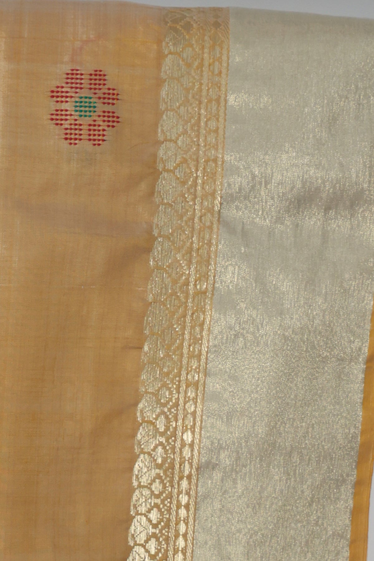 Close up of handwoven buttis on pista green Kalakshetra silk