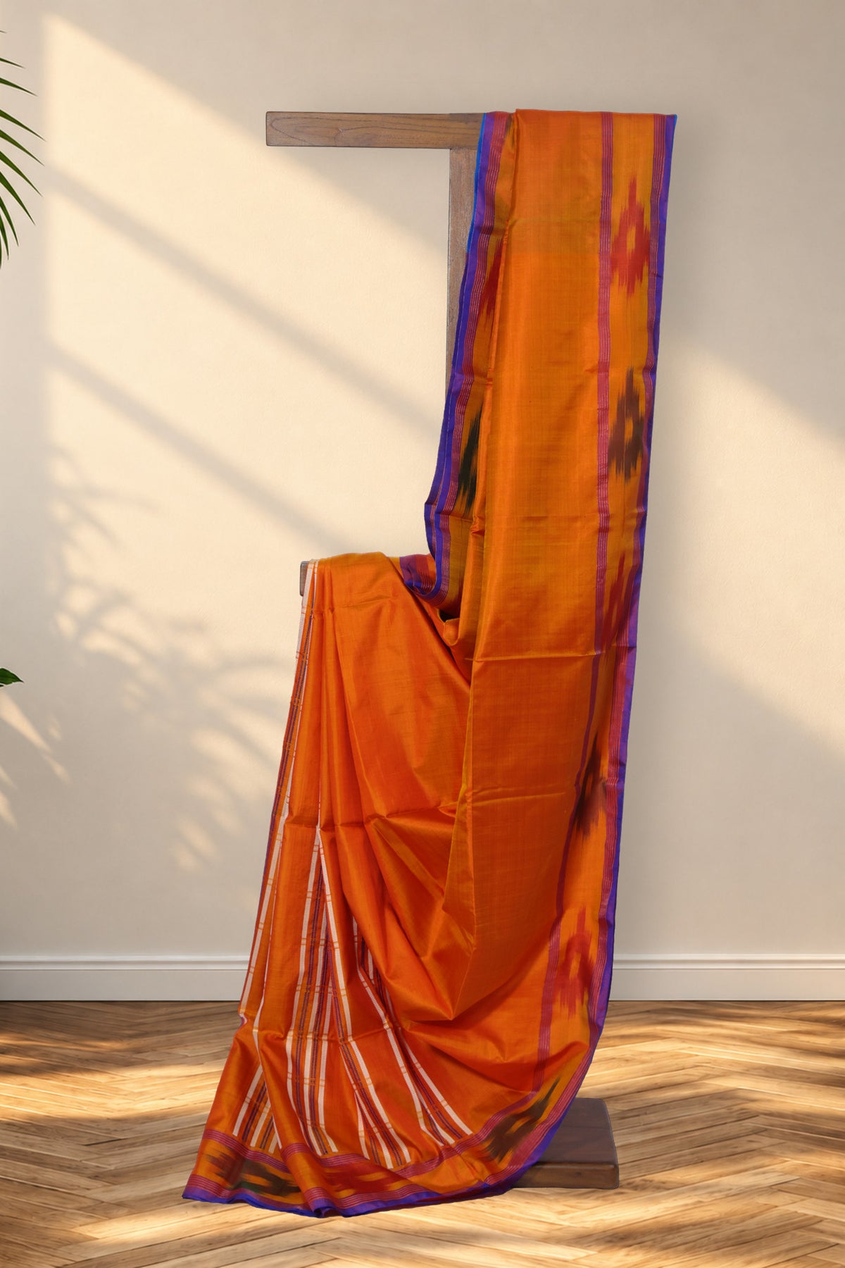 Komola Neel orange Kalakshetra silk saree with ikat border and teal blue pallu