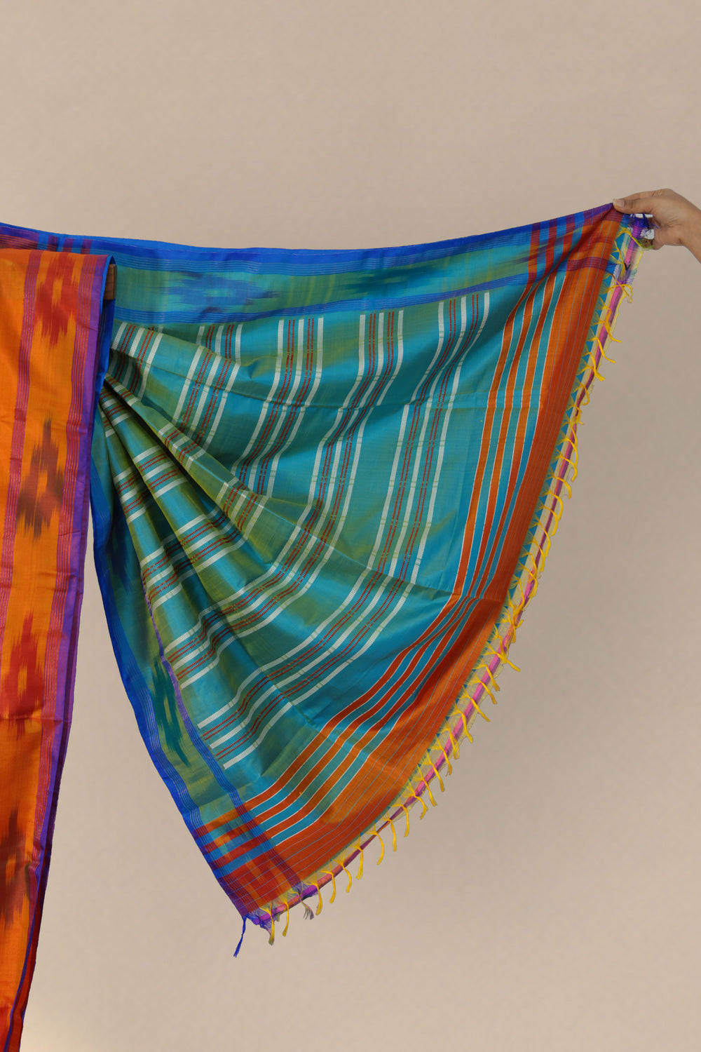 Silk ikat border on Komola Neel orange Kalakshetra saree
