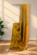 Dhaner Khet mustard yellow Kalakshetra silk saree with bottle green pallu