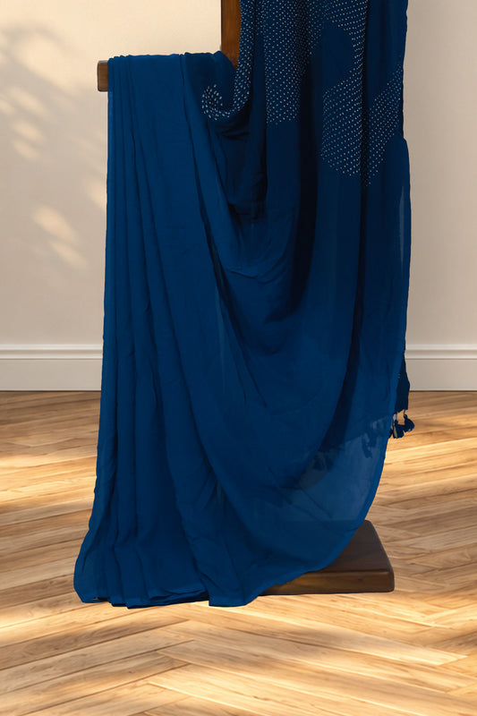 Shaded teal blue georgette saree with plain borderless body