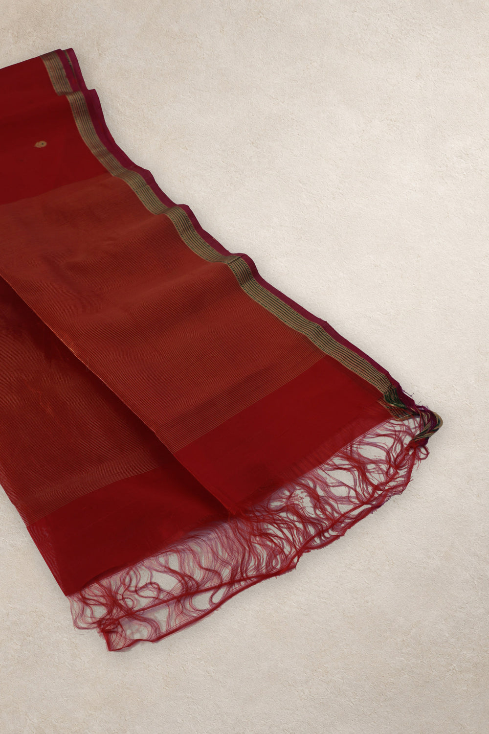 Gold zari striped pallu of Sindoori Shaam red Chanderi silk saree