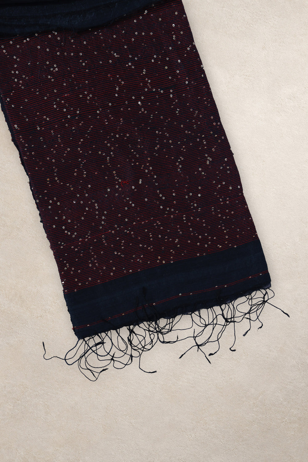 Red thread and gold sequin border on Jonaki Raat black Matka silk saree