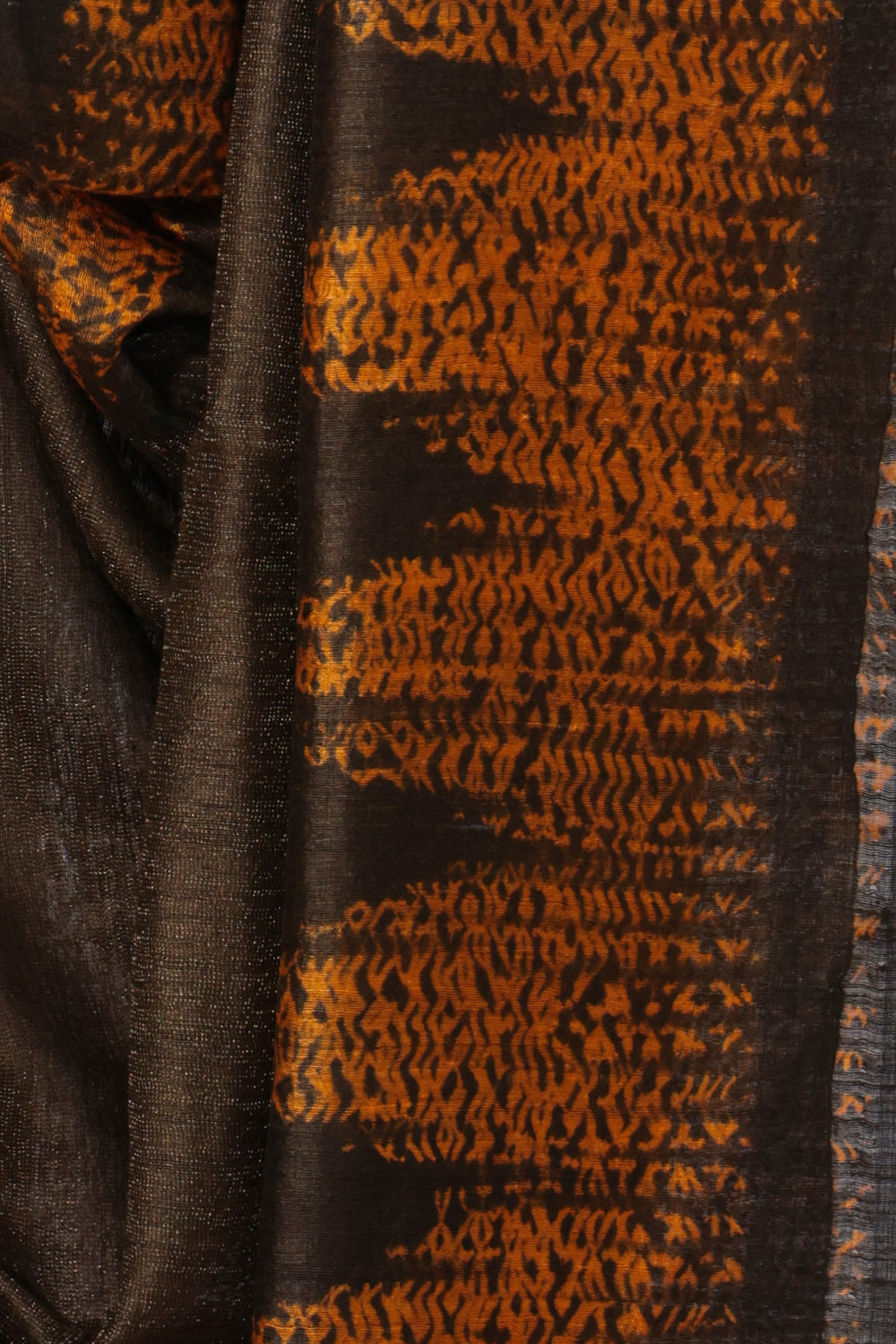 Orange and brown Shibori pallu of Agun Mati brown Matka silk saree