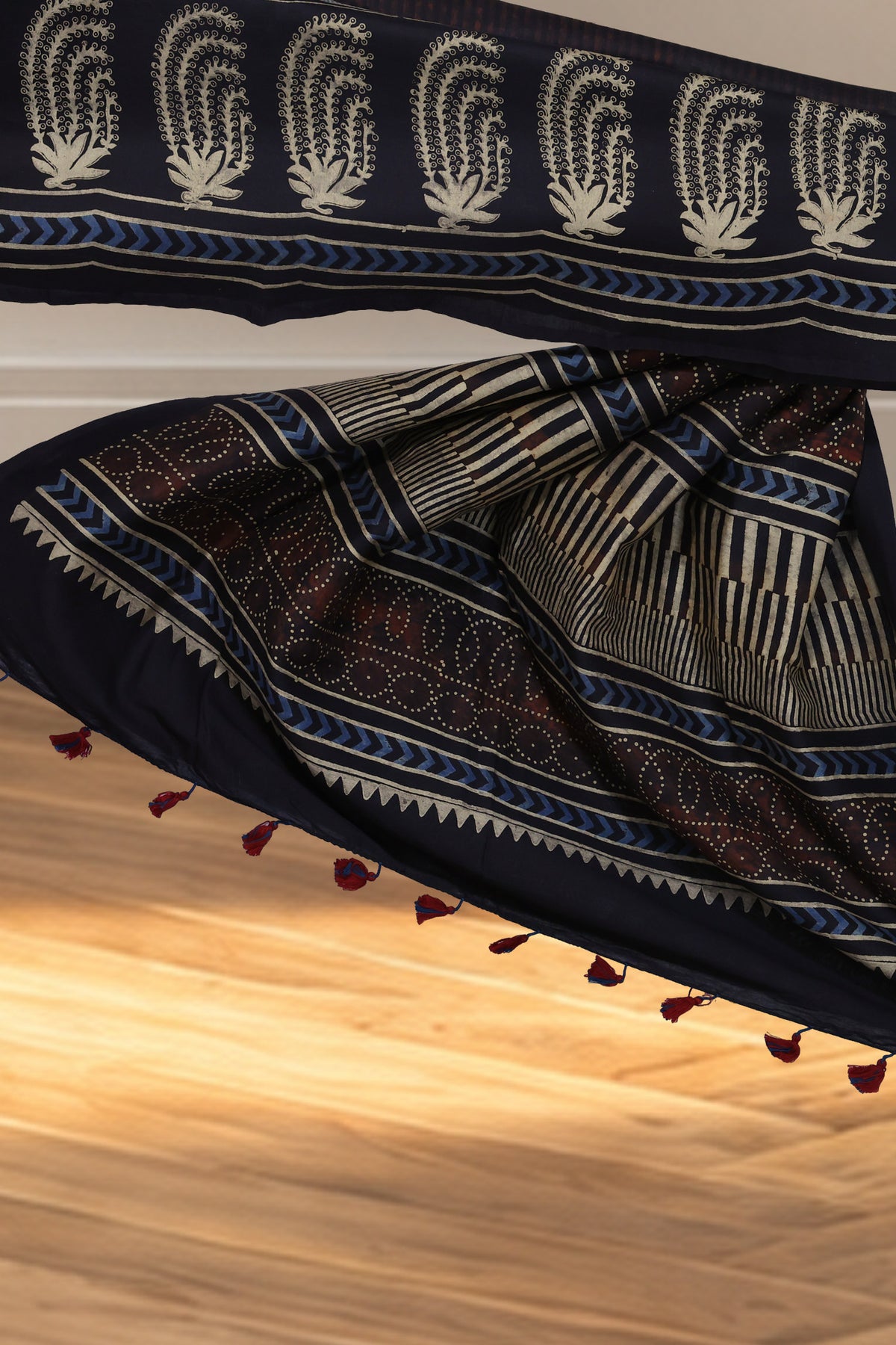 Brown white dotted circle and black white striped pallu on Ajrakh Chanderi saree