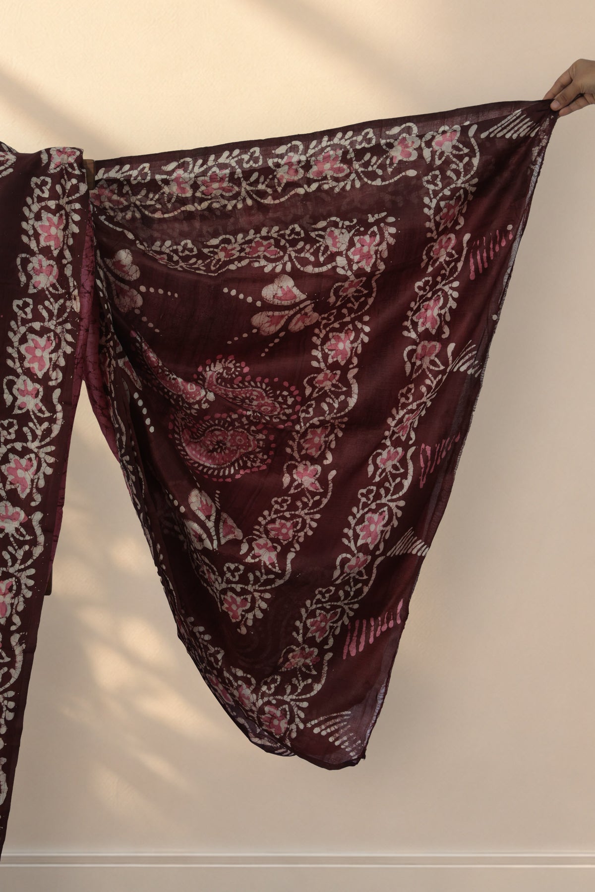 Maroon floral Batik border on Jaba Bagan pink silk saree