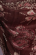 Maroon pallu with traditional flower motifs on Jaba Bagan Batik saree