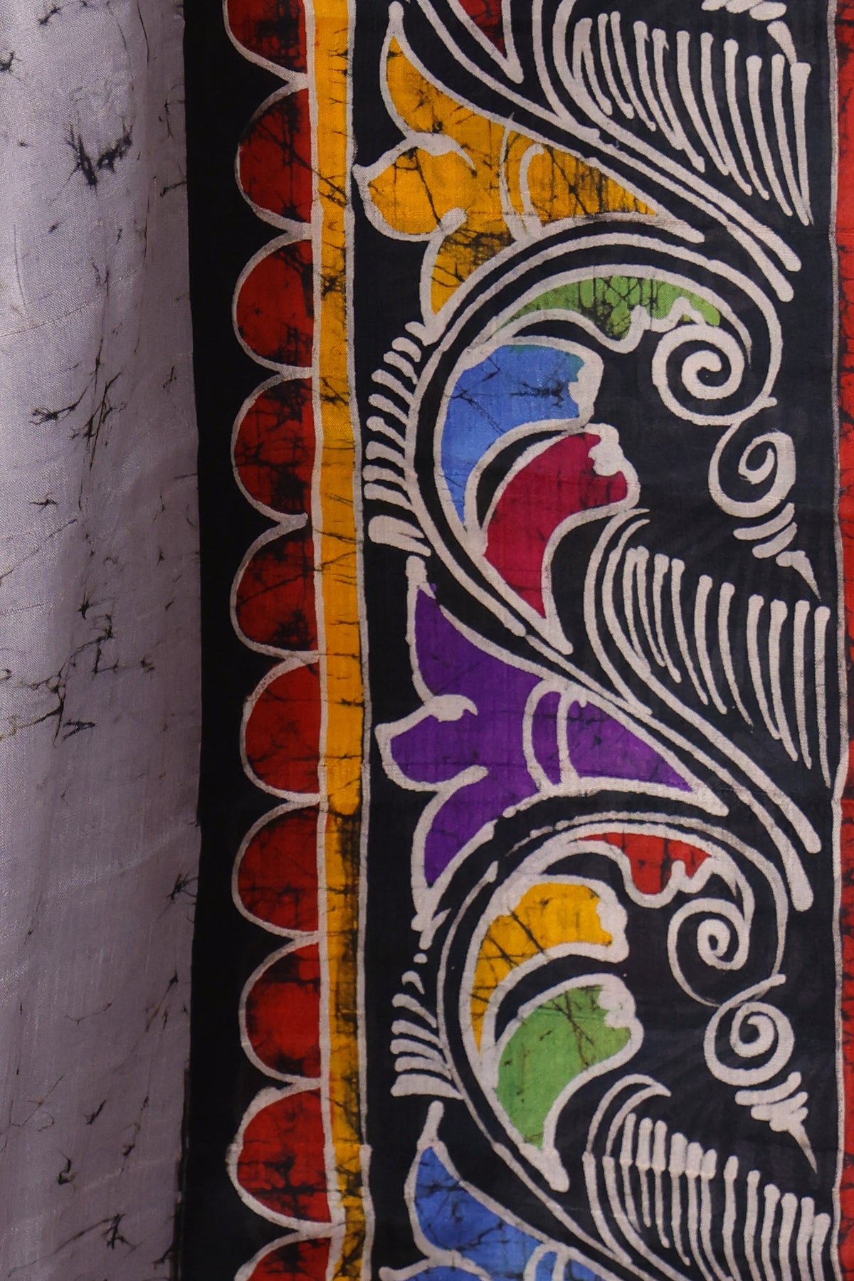 Black and multicolour floral Batik border on Megh Bela grey silk saree