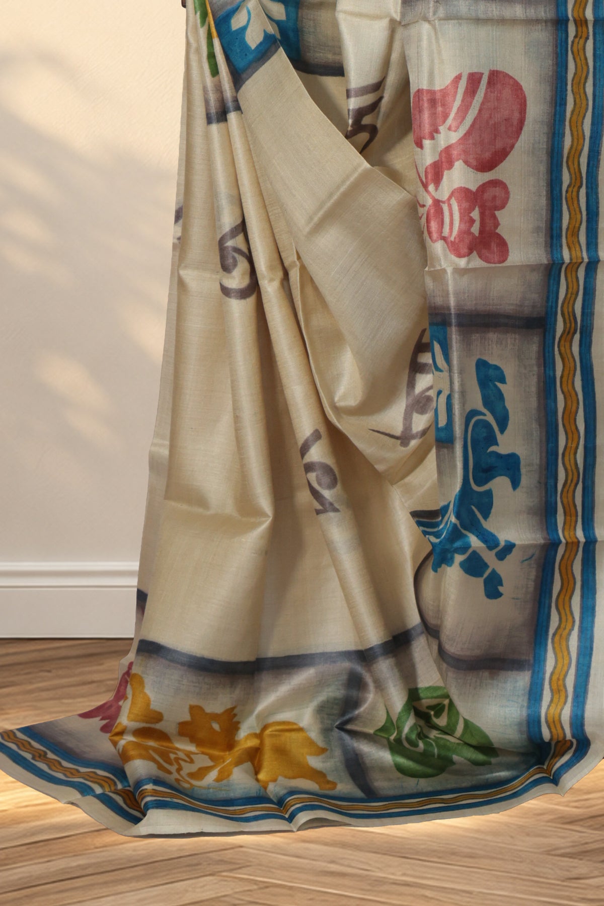 Ivory Batik Tussar saree with grey Bengali letters across the body