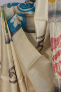 Close up of grey Bengali lettering on ivory Batik Tussar silk