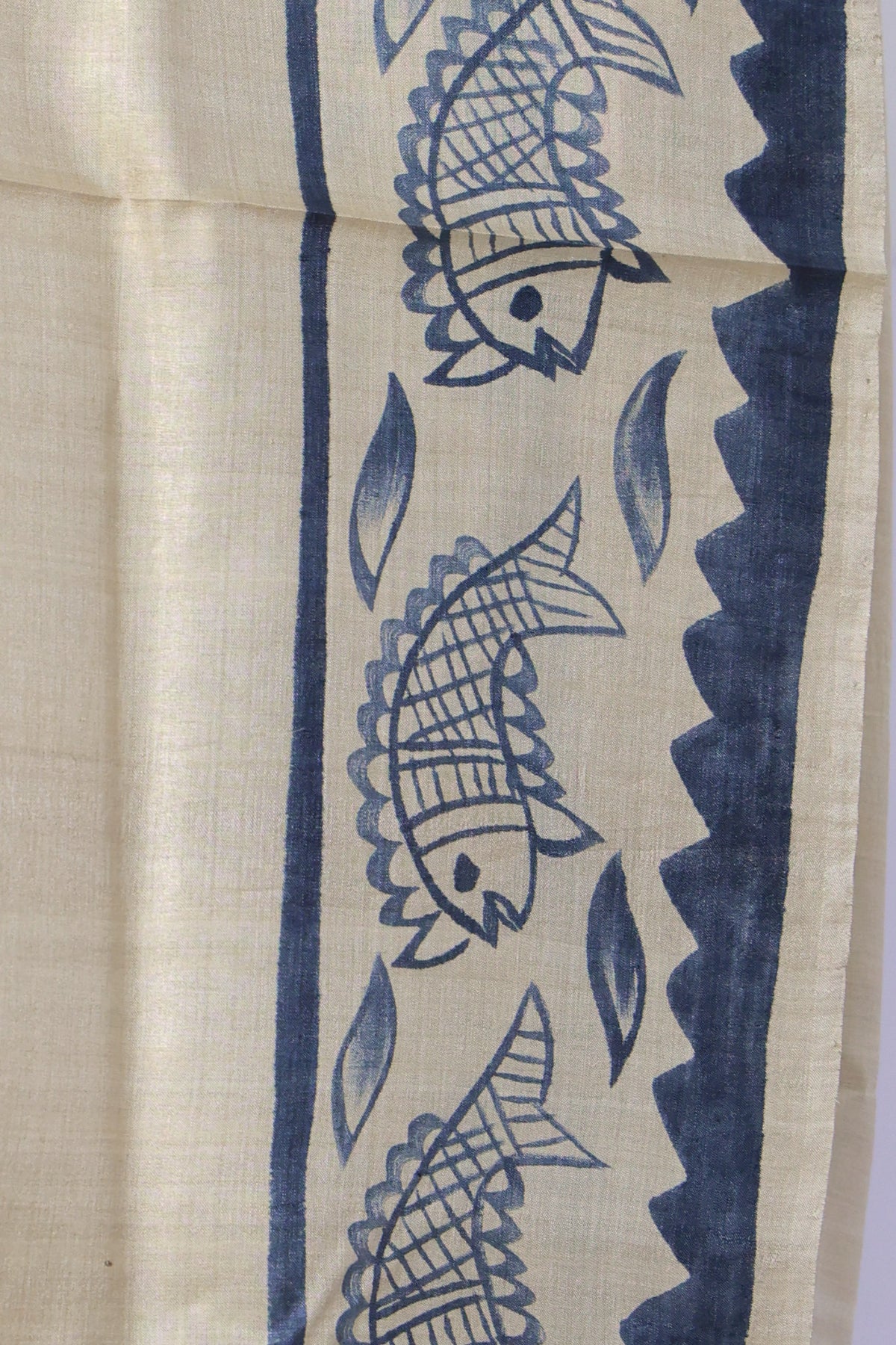 Black leaf and fish motif pallu on ivory Batik Tussar saree