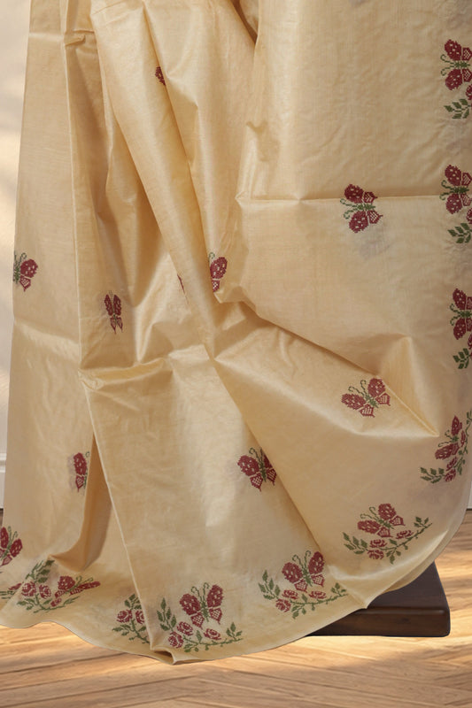 Beige Kosa Tussar saree with red and green butterfly motifs all over