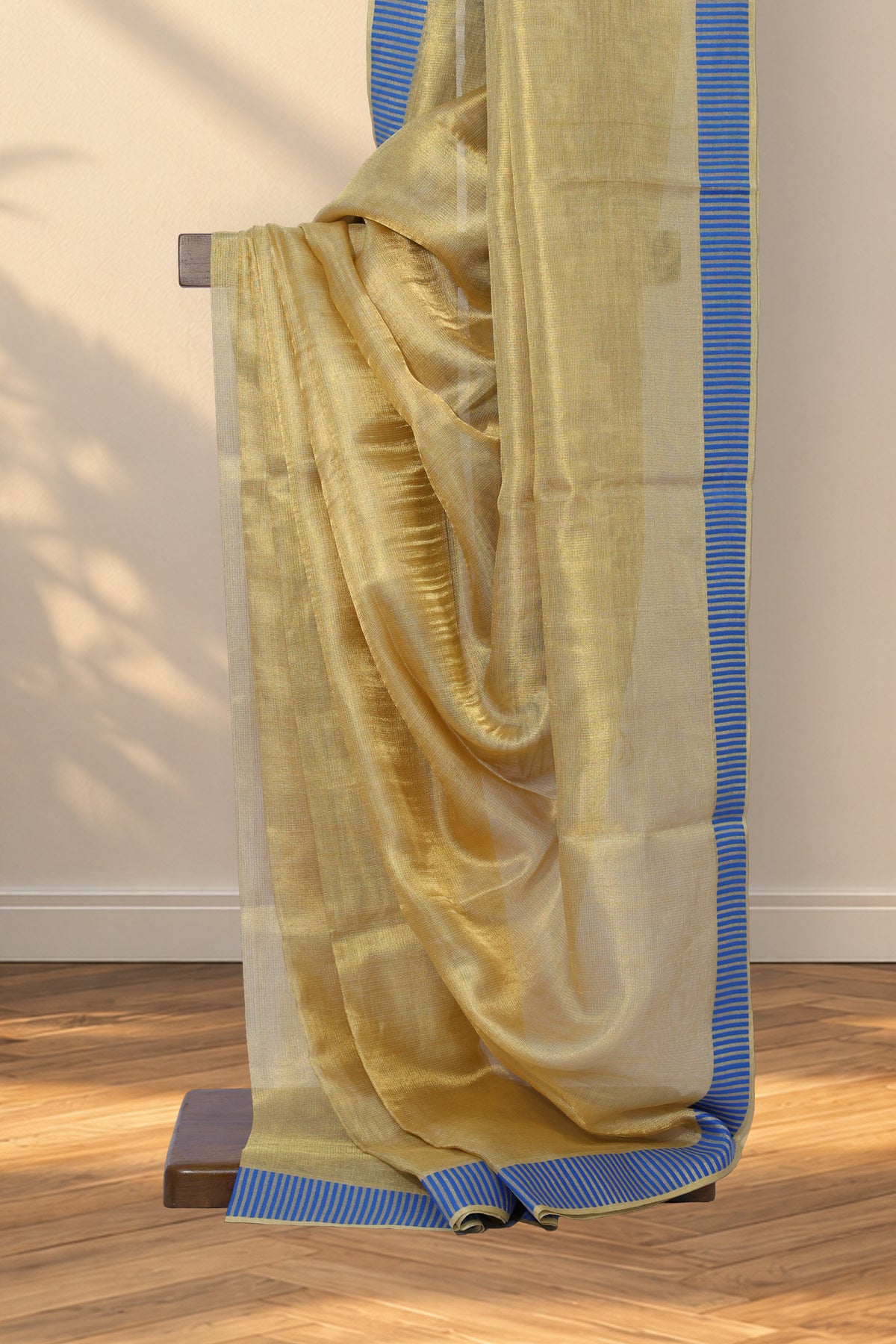 Tissue gold Kosa Tussar silk saree with plain body and blue striped border