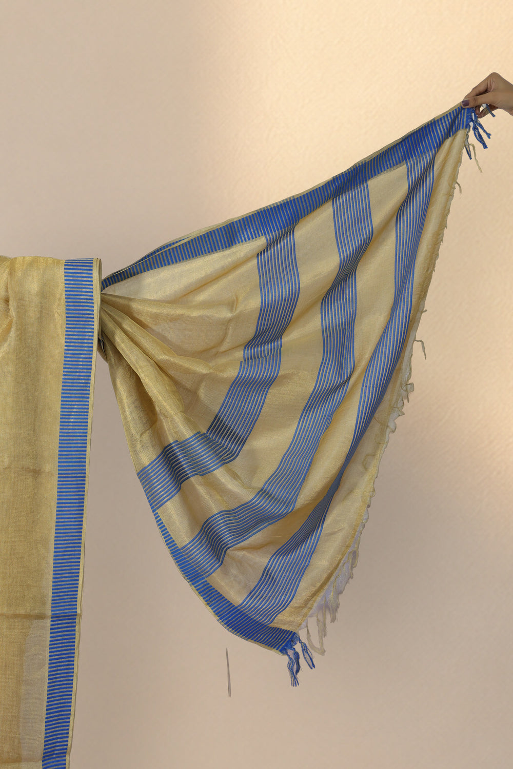 Blue and gold vertical striped border on Subarnarekha Tussar silk saree