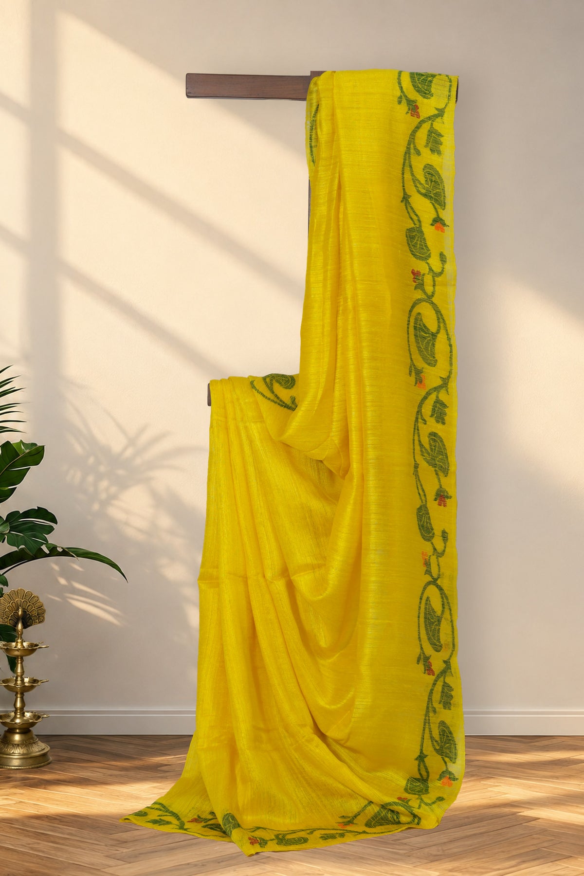 Sorshe Khet yellow Matka silk saree with red and green floral border