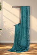 Hari Jaali green Dabu linen saree with silver zari border