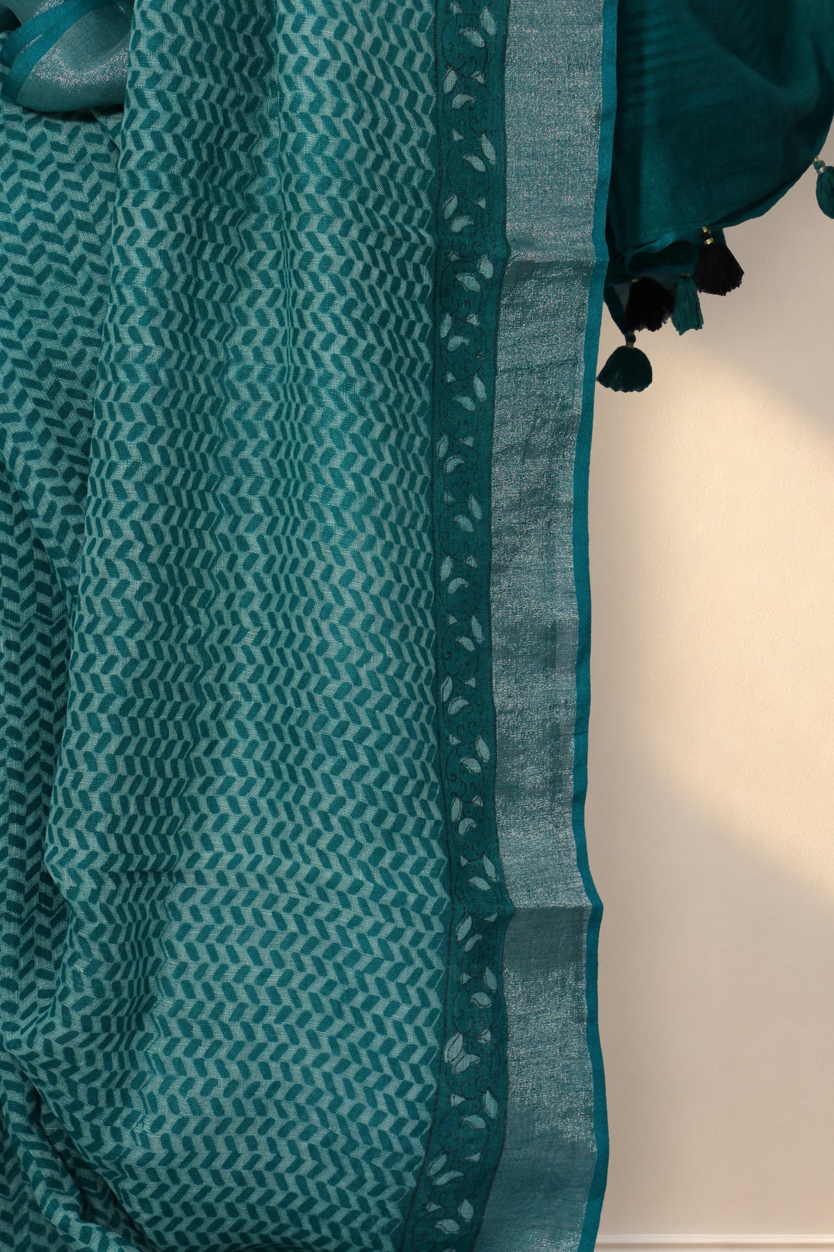 Silver zari border on Hari Jaali green Dabu hand block printed linen saree