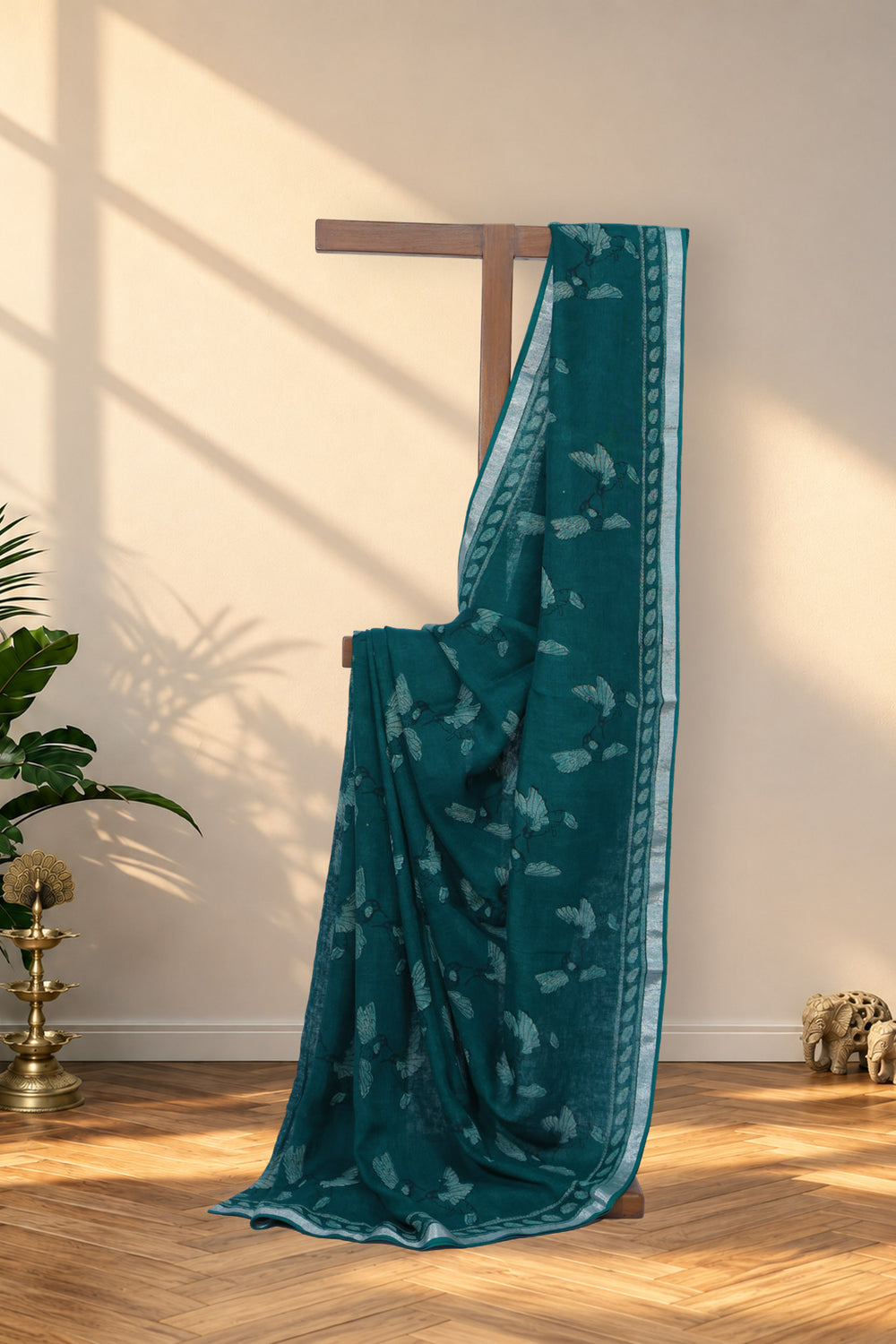 Hari Chahak green Dabu linen saree with hand block printed bird motifs