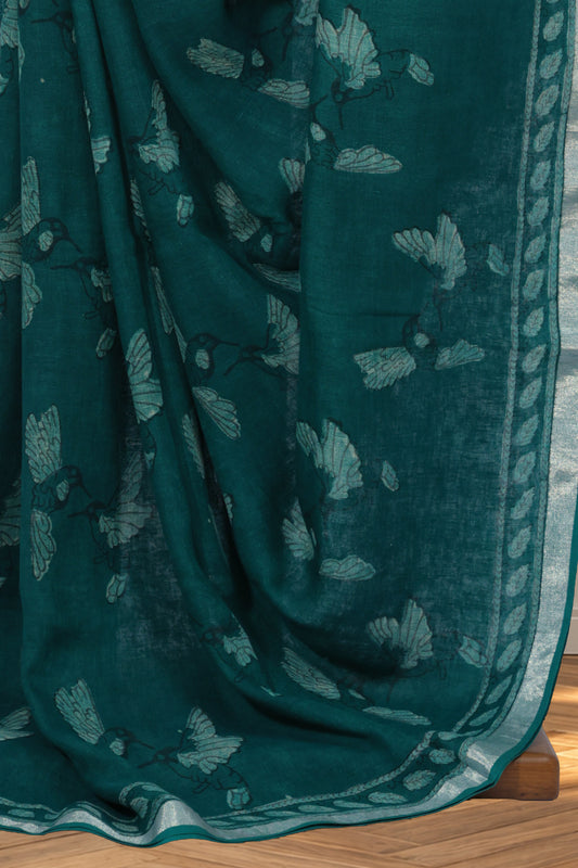 Green Dabu linen saree with bird motifs printed across the body