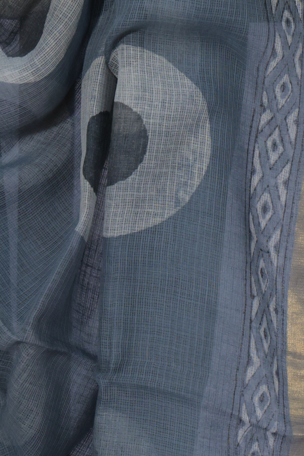 Golden zari and diamond motif border on Chakri grey Dabu saree