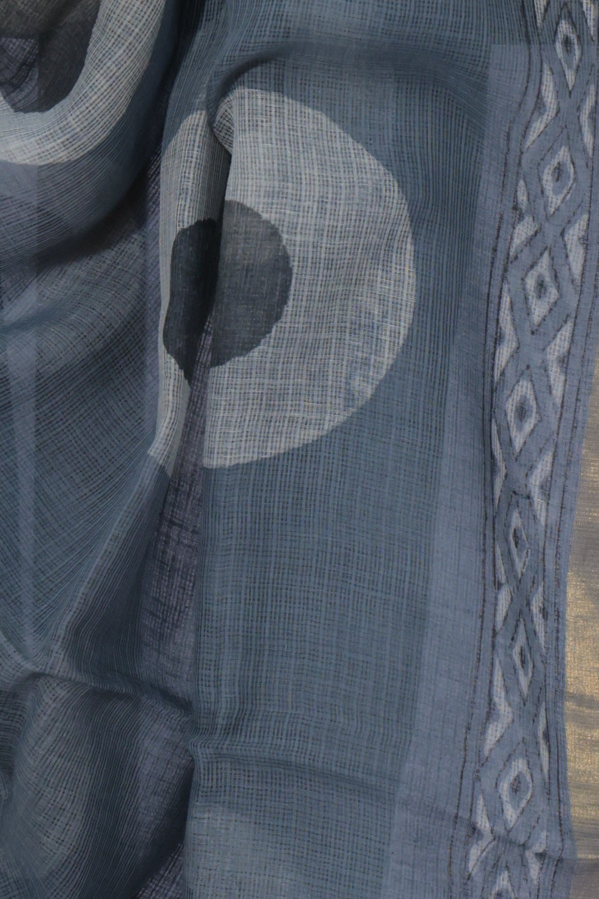 Golden zari and diamond motif border on Chakri grey Dabu saree