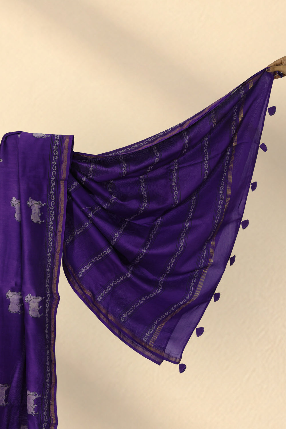Golden zari and abstract design border on Jamuni Chitra purple Dabu saree