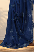 Indigo Dabu Chanderi silk saree with hand block printed flute and peacock feather motifs