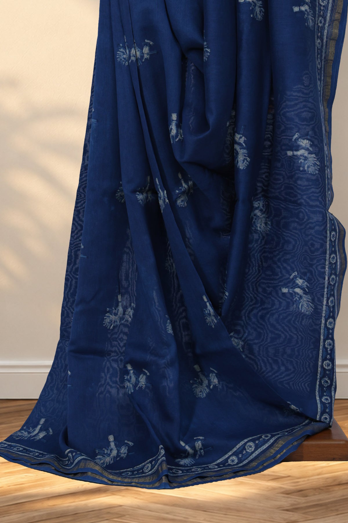 Indigo Dabu Chanderi silk saree with hand block printed flute and peacock feather motifs