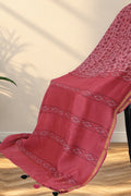 Close up of small lotus Dabu hand block printed motifs on pink Chanderi silk