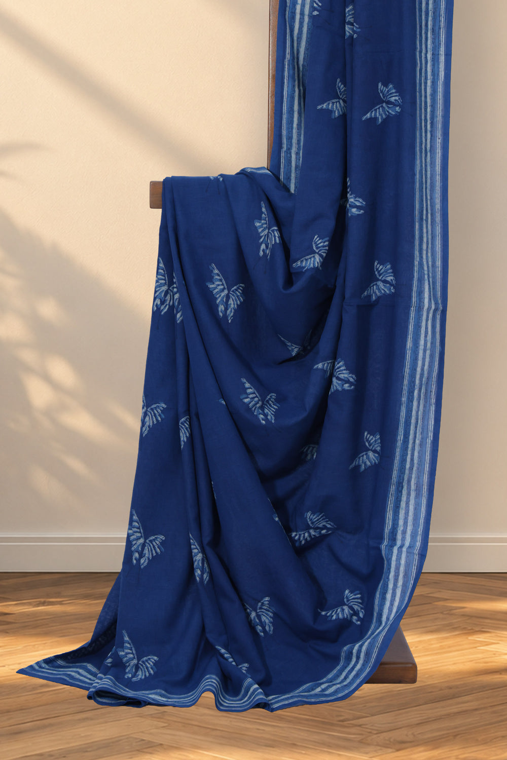 Indigo Mul Cotton Dabu saree with hand block printed butterfly motifs
