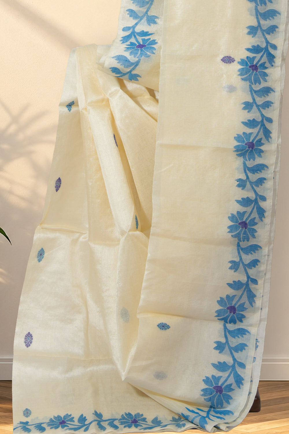 Beige Tussar silk saree with blue and indigo buttis all over