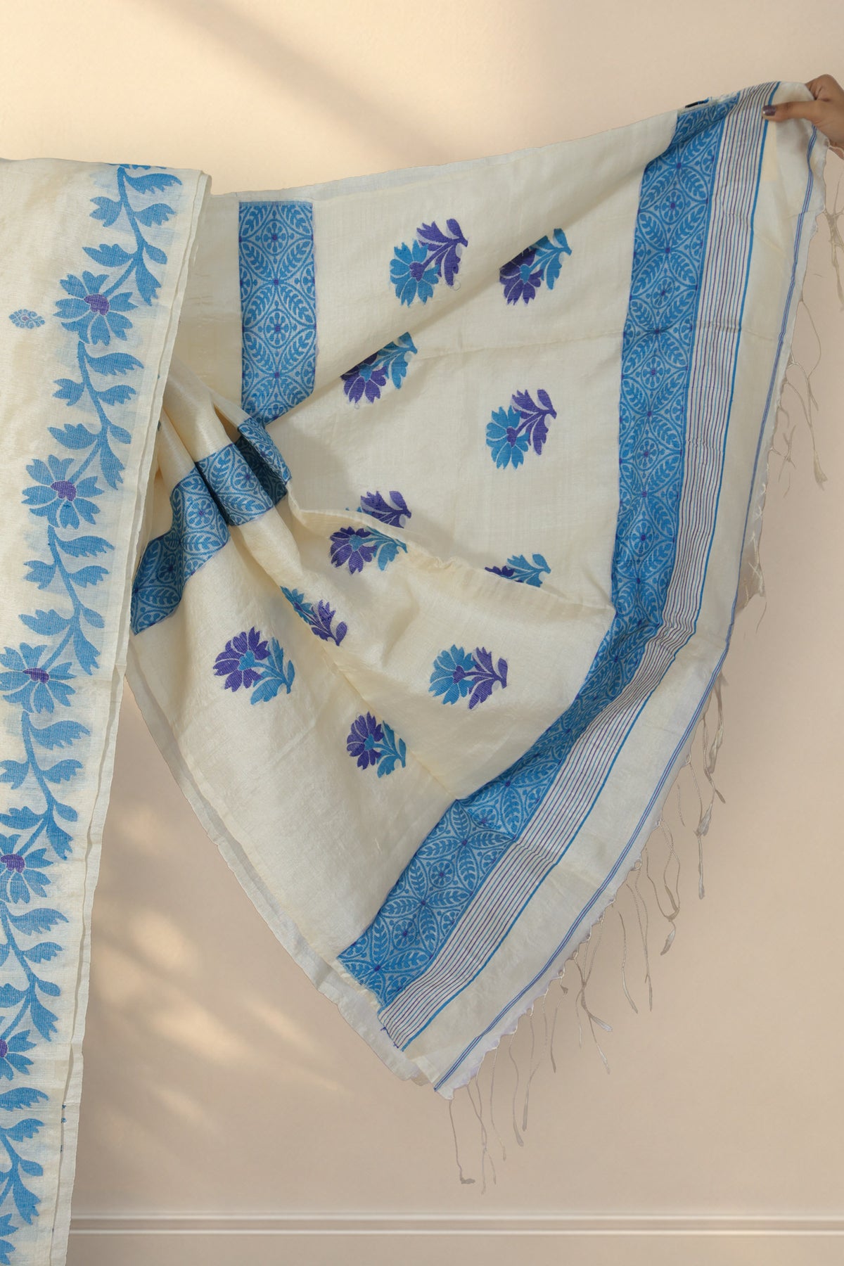 Blue floral border on Aparajita beige Tussar silk saree