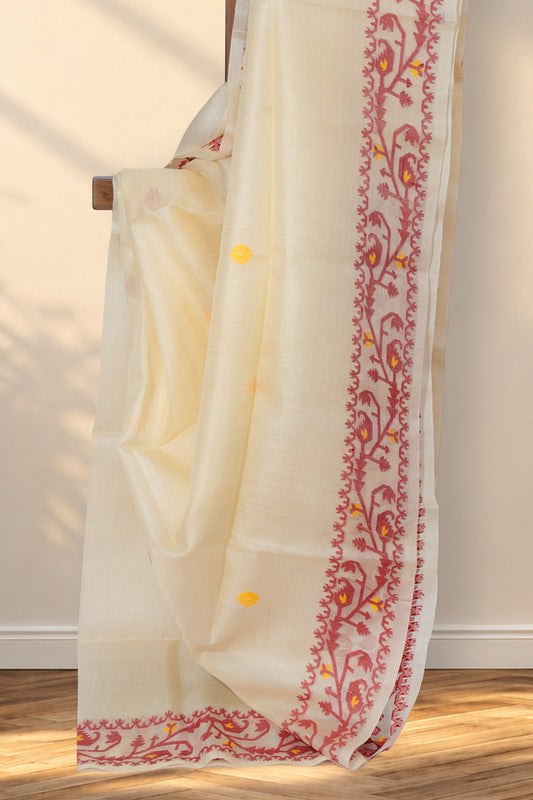 Beige Tussar silk saree with red and yellow floral buttis all over