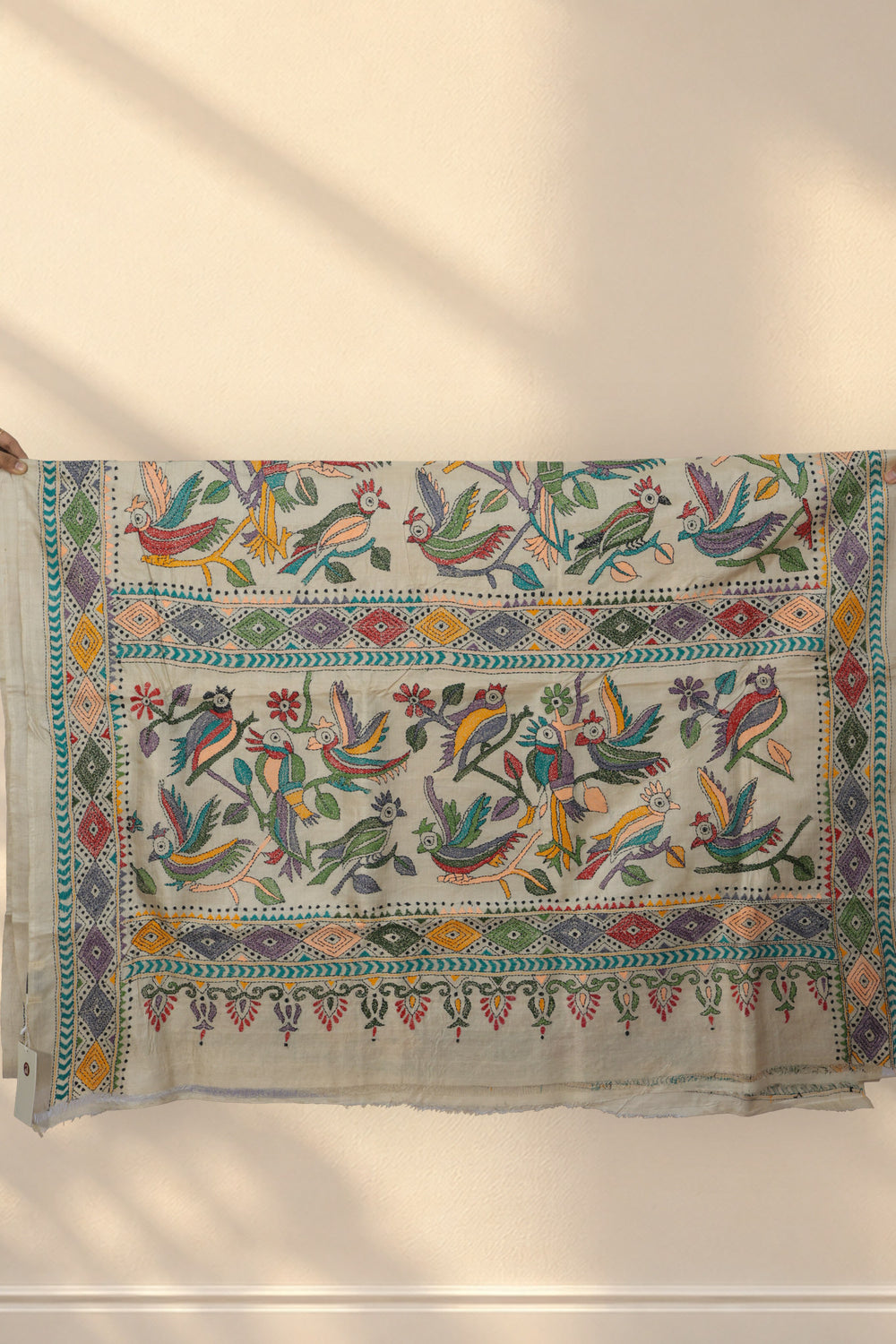 Multicolour geometric diamond skirt border on Tiya Bon Kantha Tussar saree