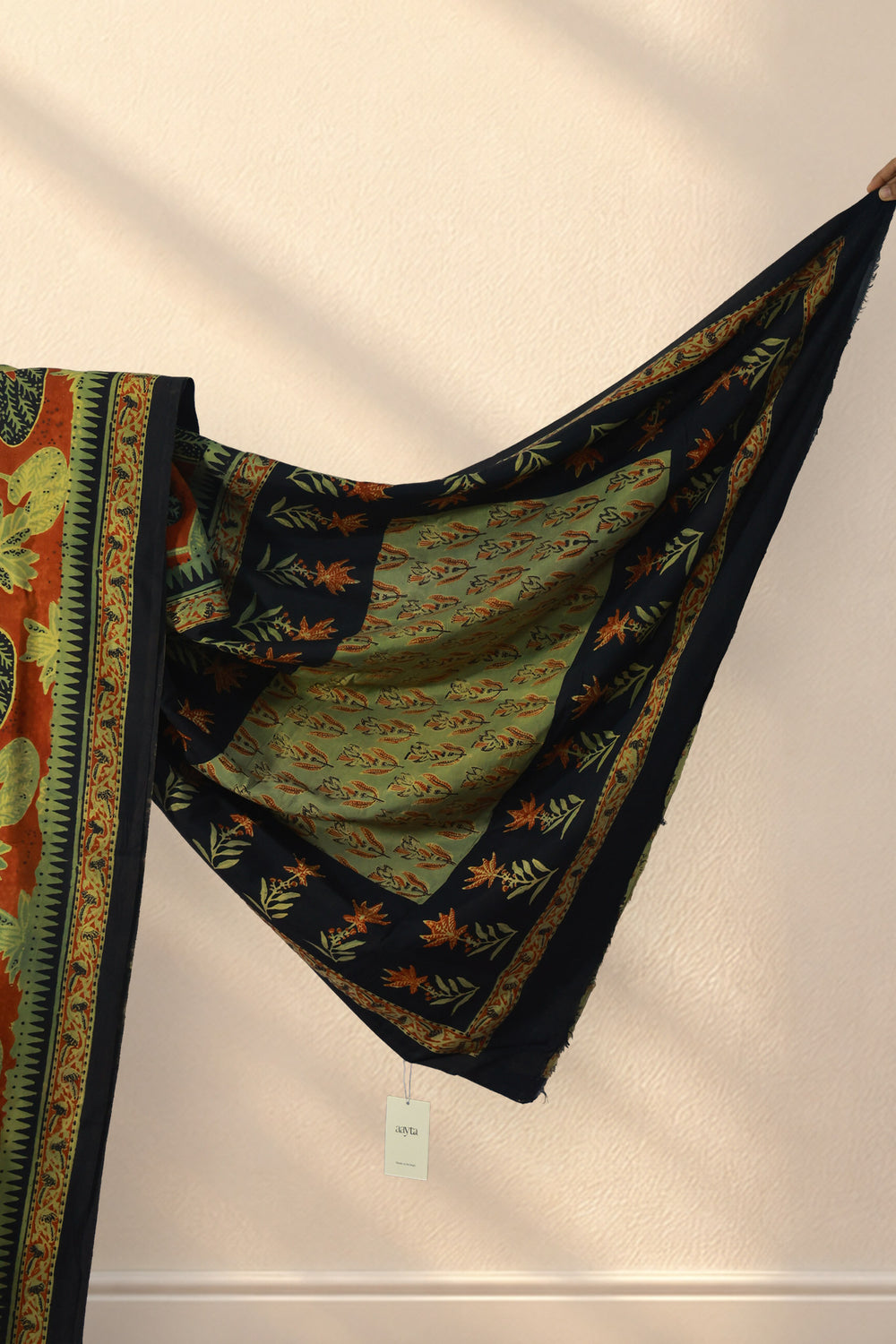 Black and green floral border on Gerua Kamal Bagru silk saree