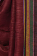 Close up of counted extra weft geometric motifs on maroon Bhujodi Tussar silk
