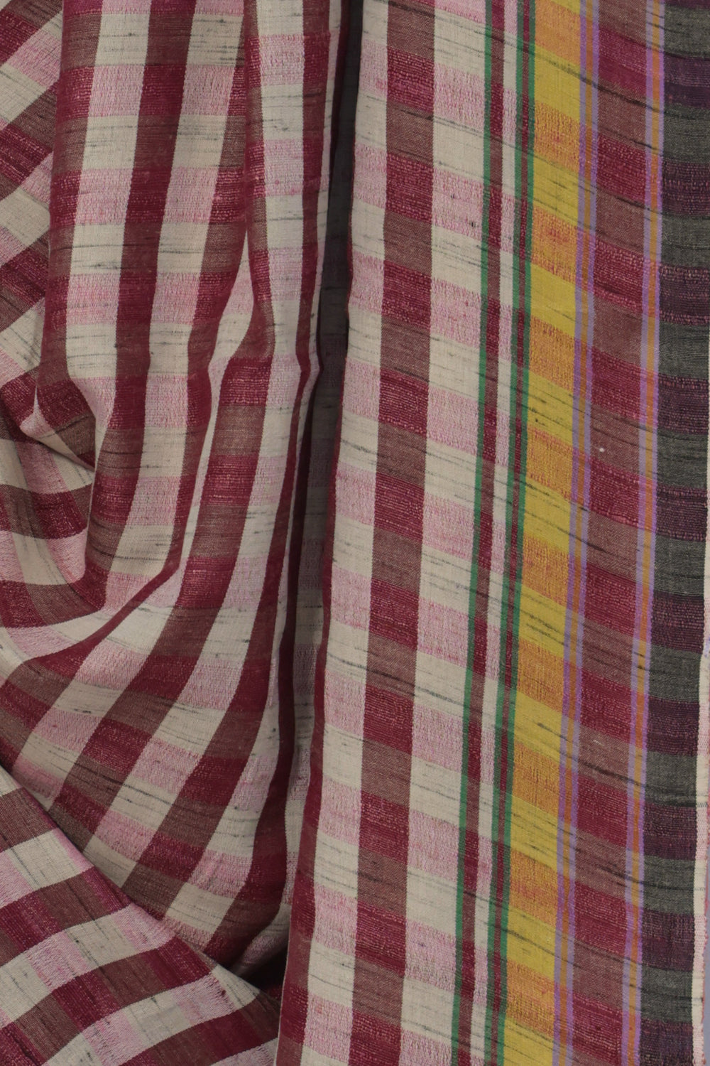 Close up of pink and white checks on handwoven Bhujodi Tussar silk