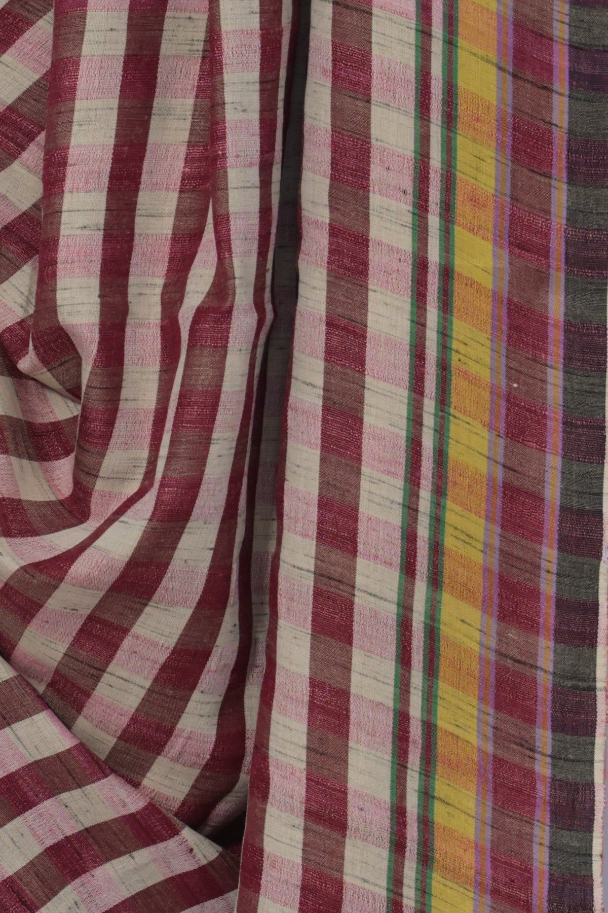 Close up of pink and white checks on handwoven Bhujodi Tussar silk
