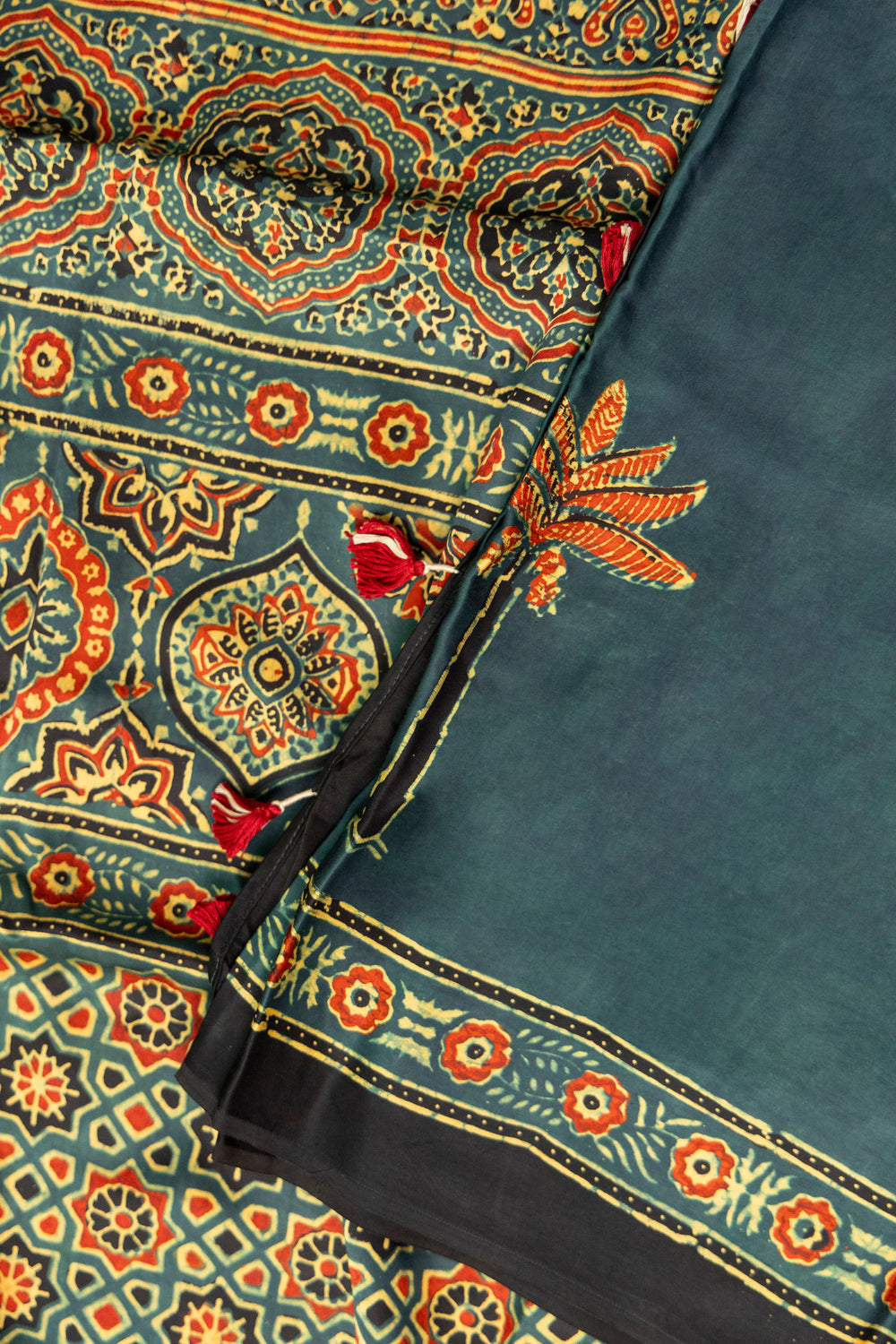 Abstract and floral printed pallu of Khajuri Baag Ajrakh saree