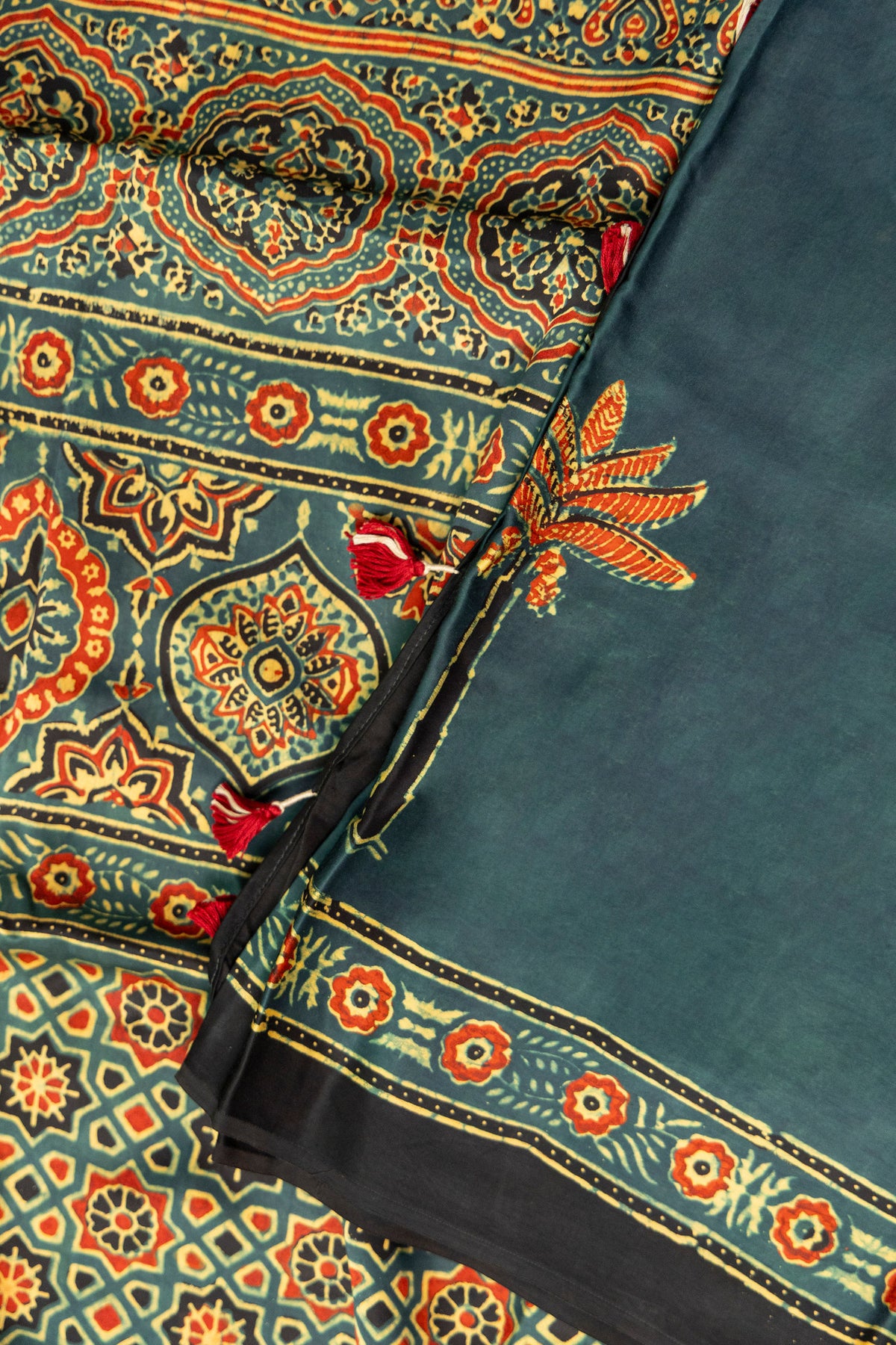 Abstract and floral printed pallu of Khajuri Baag Ajrakh saree