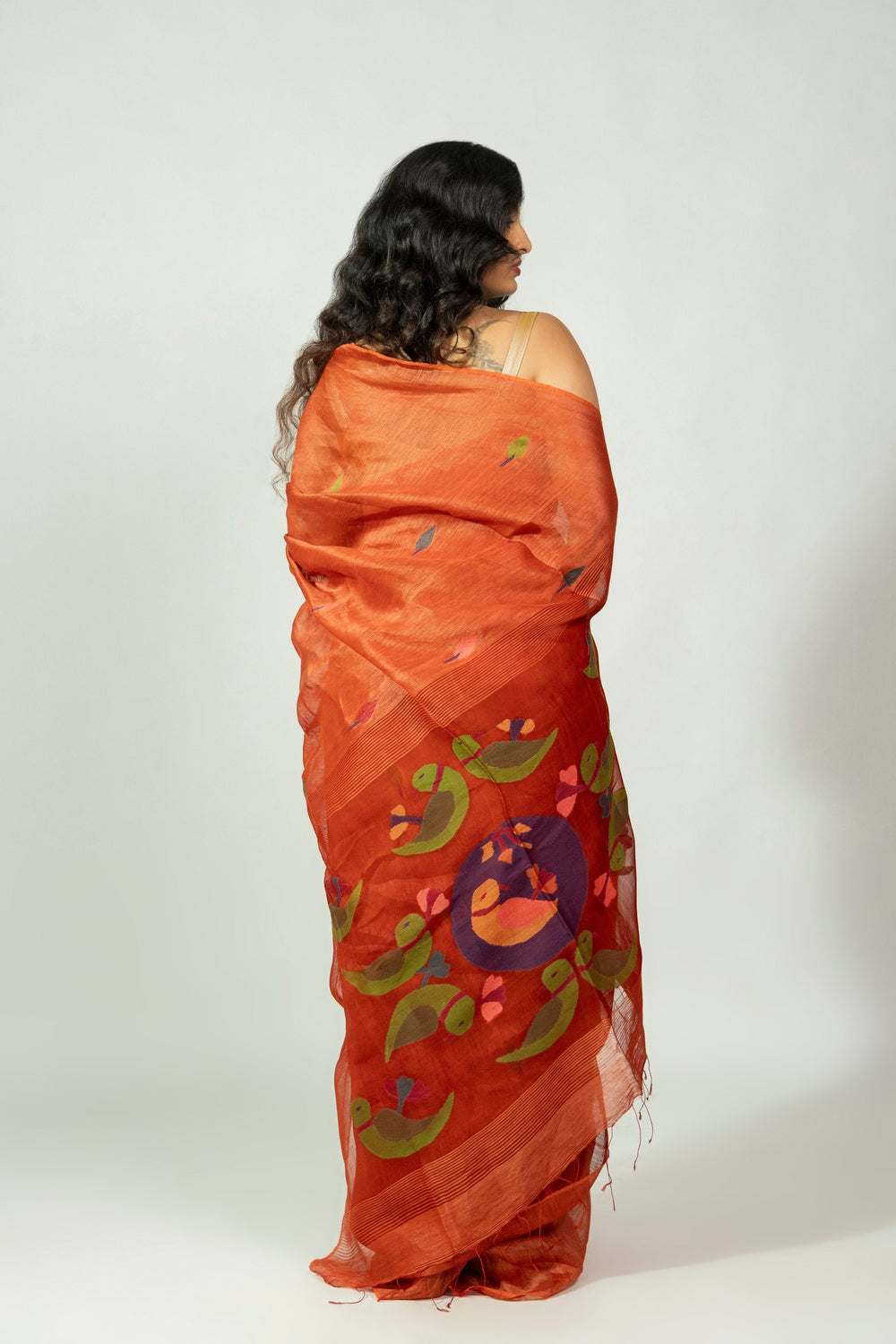 Green parrot motif needle Jamdani pallu on Komola Tia silk linen saree